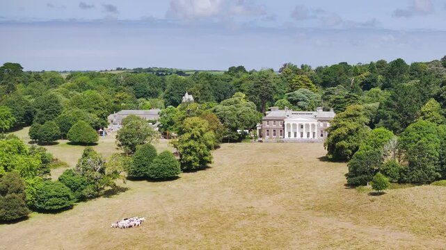 Trelissick House and Garden from drone, Carrick Roads, River Fal, Feock, Truro, Cornwall, UK