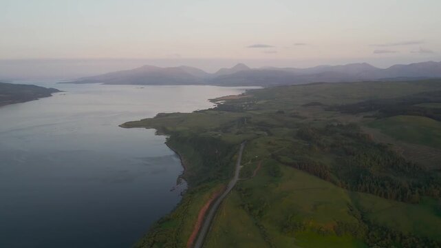 Sunset over Bay from Loch Na Guline Dubh from a drone, Tobermory, Isle of Mull, Scotland, United Kingdom