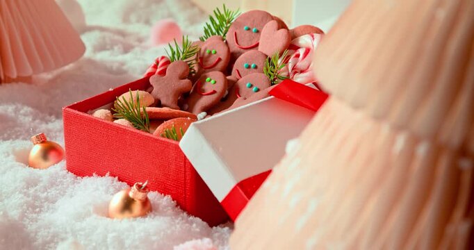 Tasty gingerbread men tucked inside present box.