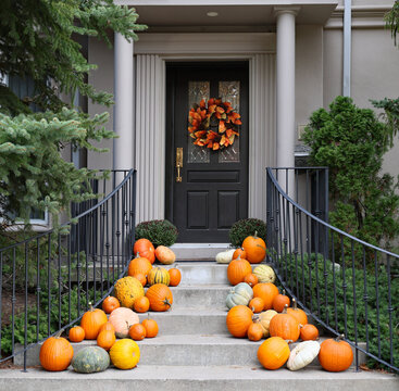 House entrance with pumpkins and fall decorations