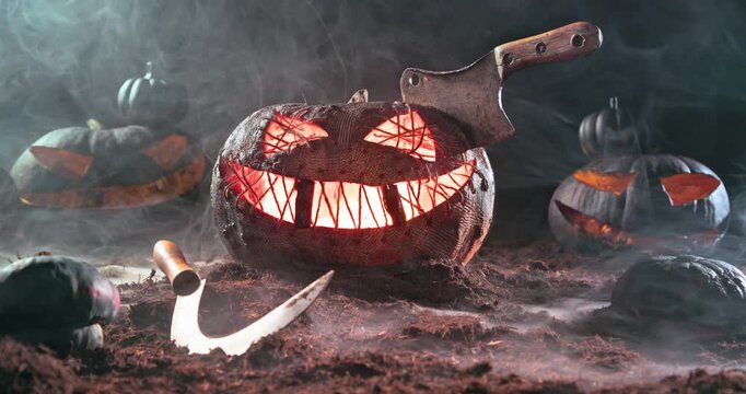 Old chopper pierce a terrifying glowing pumpkin at night.
