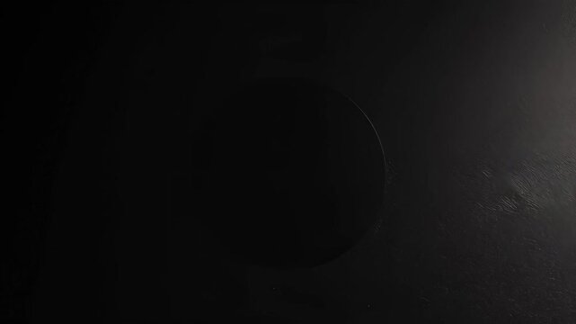 Black Circular Disk on Dark Textured Surface, Minimalist Abstract Composition