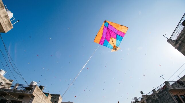 Colorful Flying Kite against Blue Sky for Makar Sankranti Festival