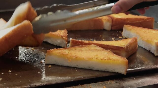 The bread is fried in butter or oil in a frying pan  . Making toast or croutons. 