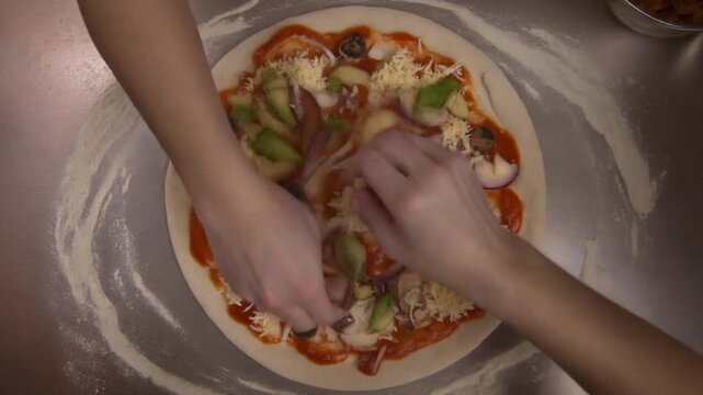 Top View Time-Lapse of Chef Hands Preparing Pizza and Adding Fresh Toppings