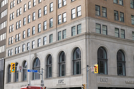 corner exterior building facades and signs of IWC Schaffhausen Boutique, located at 170 Bloor St W, Toronto 