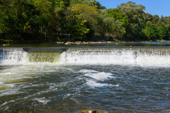Water flows over a weir on the Humber River