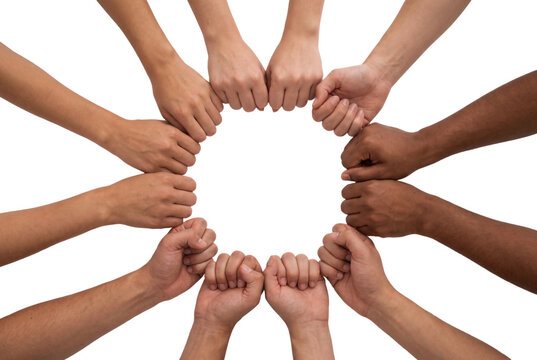 Diverse people joining fists in circle for unity and teamwork