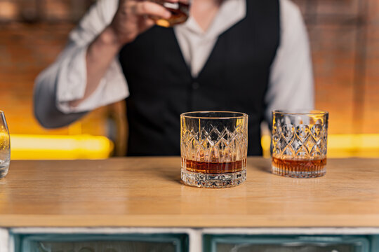 Bartender Serve Whiskey, on wood bar,