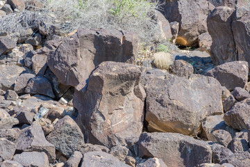 Ancient Petroglyph Carved into Volcanic Boulder © Kit Leong