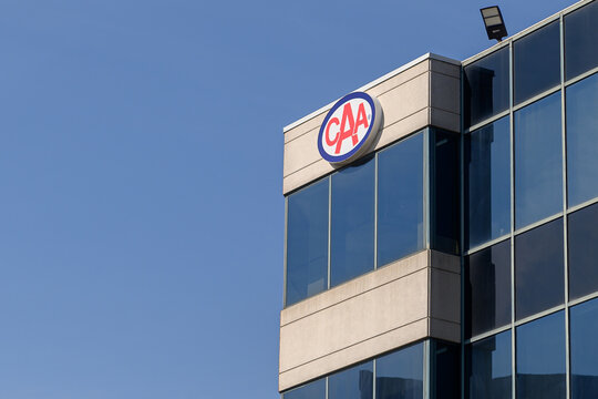 CAA company logo and office building in Toronto.