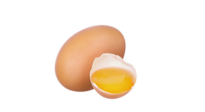 Fresh brown chicken egg whole and broken with yolk isolated on black background