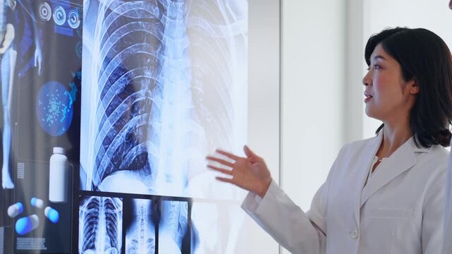 A group of male and female doctors holding a meeting while looking at a screen. doctors, medicine, hospital, treatment, conference, medical consultation, diagnosis, surgery