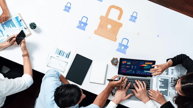 A business meeting focused on cybersecurity strategies, featuring professionals analyzing data protection measures, discussing risks, and collaborating on solutions in a modern workspace. Raster