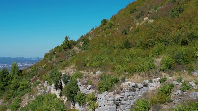 Beautiful autumn sunset over ancient Persqopi Castle fortress ruins built by Illyrian Parthini