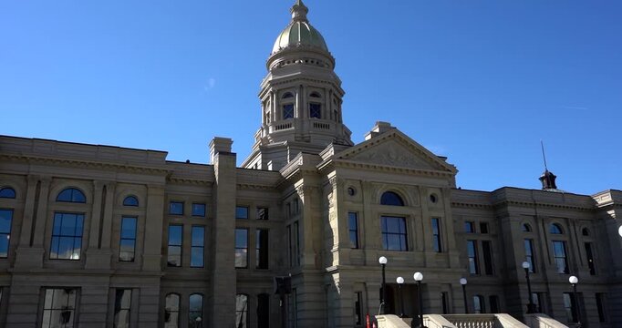 Wyoming State Capitol building front view under blue sky