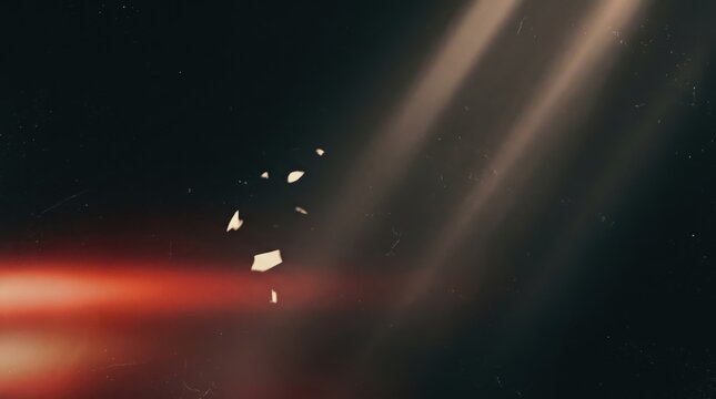 Cinematic light rays with floating dust particles on dark background, atmospheric sunbeams and red lens flare for film aesthetic, moody lighting effect for creative overlays and video editing.
