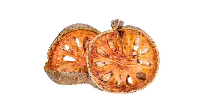 Dried bael fruit wood apple slices isolated on black background