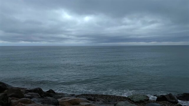 Cloudy sea conditions and waves fill a wide coastal view, supporting marine weather reporting, shoreline observation and environmental monitoring along the Black Sea coast of Georgia