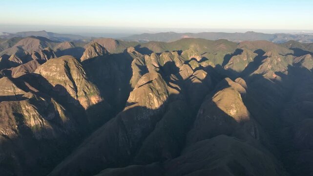Codo de los Andes Mountain Ridges and Deep Valleys in Warm Golden Light in Bolivia. Establishing Shot. Aerial View.