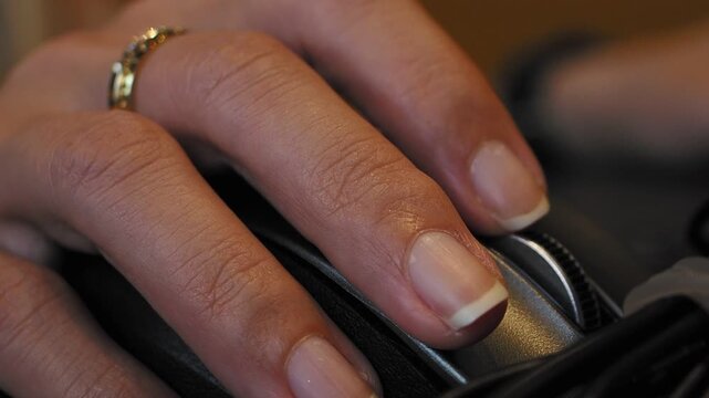 Hand Using a Computer Mouse for Digital Work