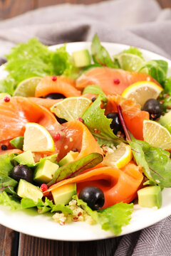 Fresh smoked salmon salad with avocado lemon and black olives
