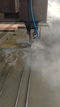 Coolant fog drifting over metal cutting zone in machine