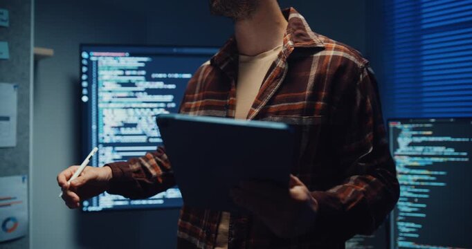 Confident Caucasian male engineer presents software strategy during late night work in office. Experienced tech consultant expertise, Innovative startup leader, Professional online conference concept.