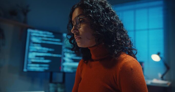 Close-up Black female programmer typing coding on keyboard working late in home office at night. Cybersecurity, AI algorithm, Network security, software developer, remote workspace overtime concept.