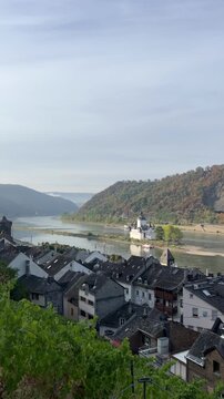 selective focus breathtaking view of kaub rooftops and medieval rhine island castle