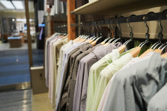 Row of clothes hanging on a hanger. The concept of organization and order. Clothing sale concept background