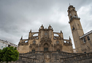 View of Jerez Cathedral, Catedral de Jerez de la Frontera, under dramatic cloudy skies in Jerez de la Frontera, Andalusia, Spain.  © ihervas