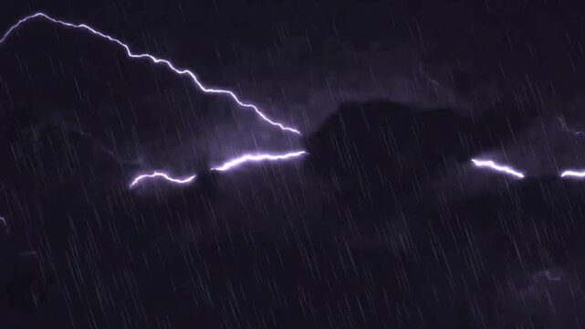 Heavy rain and dramatic lightning storm flashes in the dark night sky loopable video.