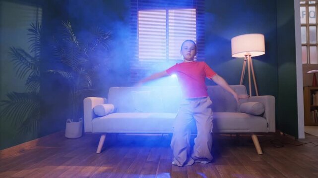 Ten year old dancer performs modern urban dance steps at home