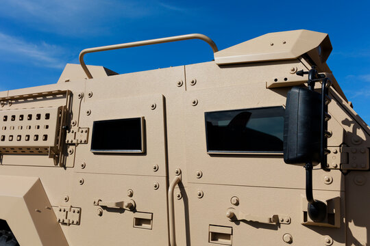 Detail of bullet proof armored and armoured vehicle. Military personnel carrier with heavy armor and ballistic  resistant protection on the doors and windows.