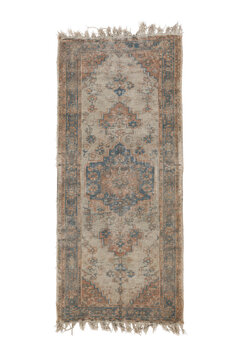 Rectangular vintage distressed rug with a faded geometric pattern in blue and terracotta, featuring fringed edges on a white background