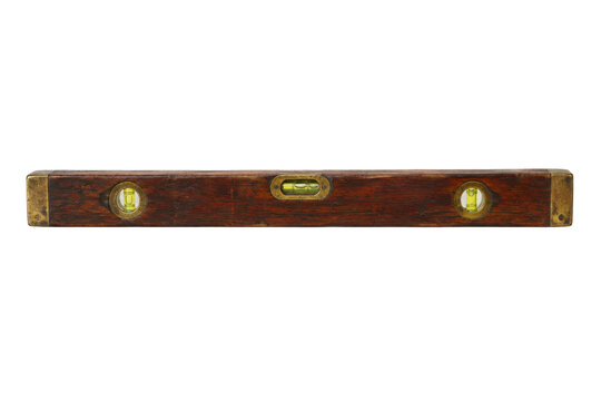 Old wooden spirit level with brass ends and three bubble vials, isolated on a clean white background