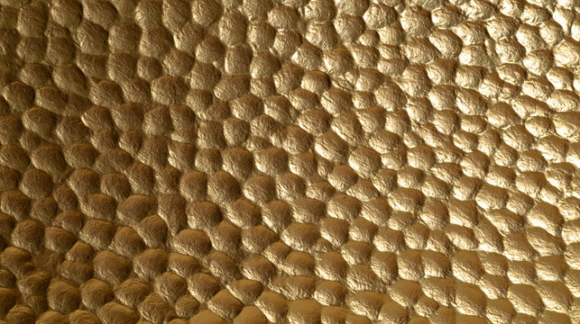 A close up view of a metallic golden texture with a bumpy organic pattern. This luxurious surface is perfect for abstract design backgrounds.