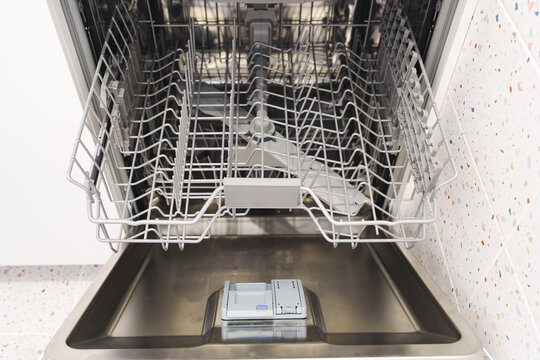 Open Empty Dishwasher Basket Close Up Shot
