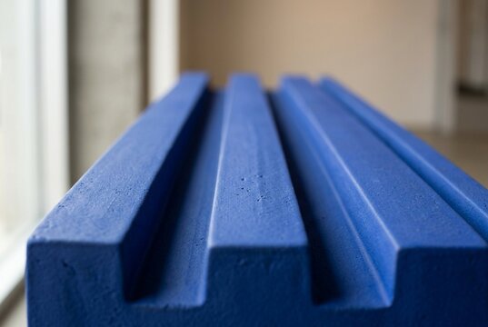 Matte Cobalt Blue Architectural Surface with Raised Parallel Ribs