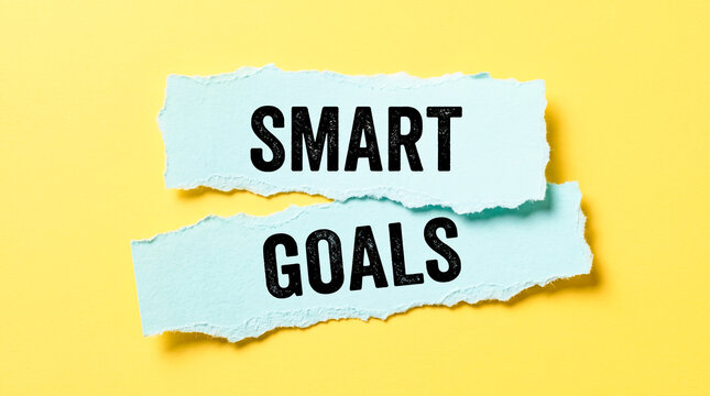 Creative light cyan torn paper displaying SMART GOALS for business planning and productivity