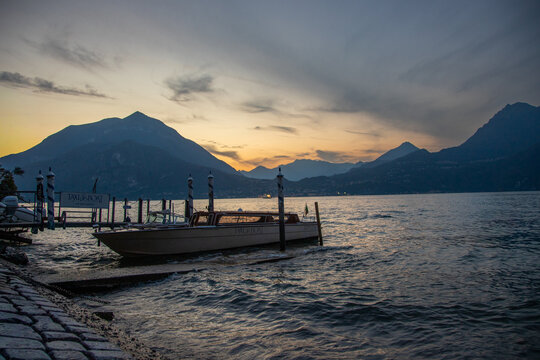 Taxi boat on Lake Como at sunset, Varenna, Italy