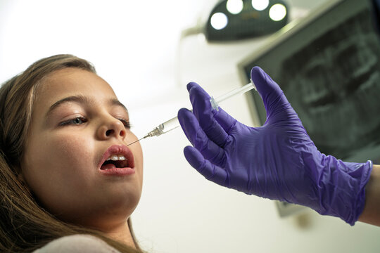 Closeup shot of worried girl  , fear of dentists concept