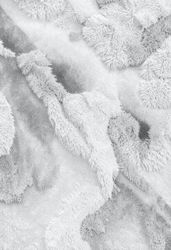 Abstract white fluffy fur texture background with soft woolen plush fabric surface in light grey tones