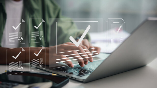 Person hands typing on laptop with online document approval icons overlay for survey checklist. quality assurance. regulatory compliance. testing process and digital task management background