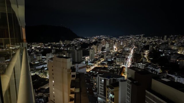 Night Timelapse of Juiz de Fora Framed by Balcony View