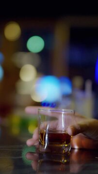businessman holding whiskey, a restaurant	