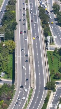 Traffic flow on the highway with cars moving in both directions in a city area