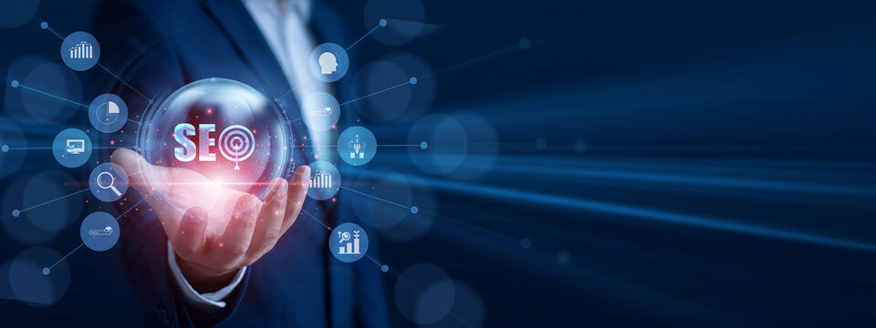 SEO specialist holding the hand glowing search rank icon. Professional analyzing web traffic sales data and economic growth graph chart on hologram screen. Search engine optimization.