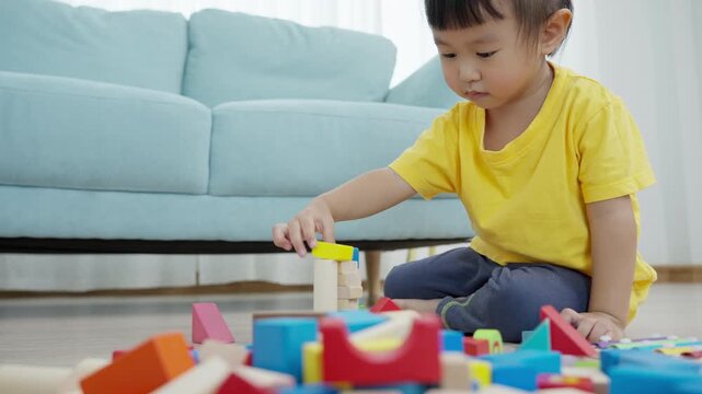 Happy Asia children play and learn toy blocks.family is happy and excited in the house. daughter having fun spending time, Activity, development, IQ, EQ, meditation, brain, muscles, essential skills.